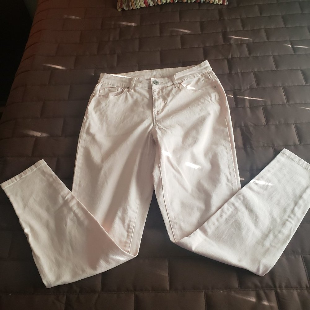 Pale pink skinny jeans